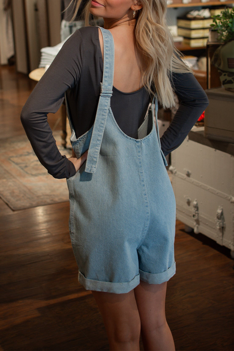 Mono vaquero holgado informal de uso diario con cuello en U, sin mangas y bolsillos de color liso