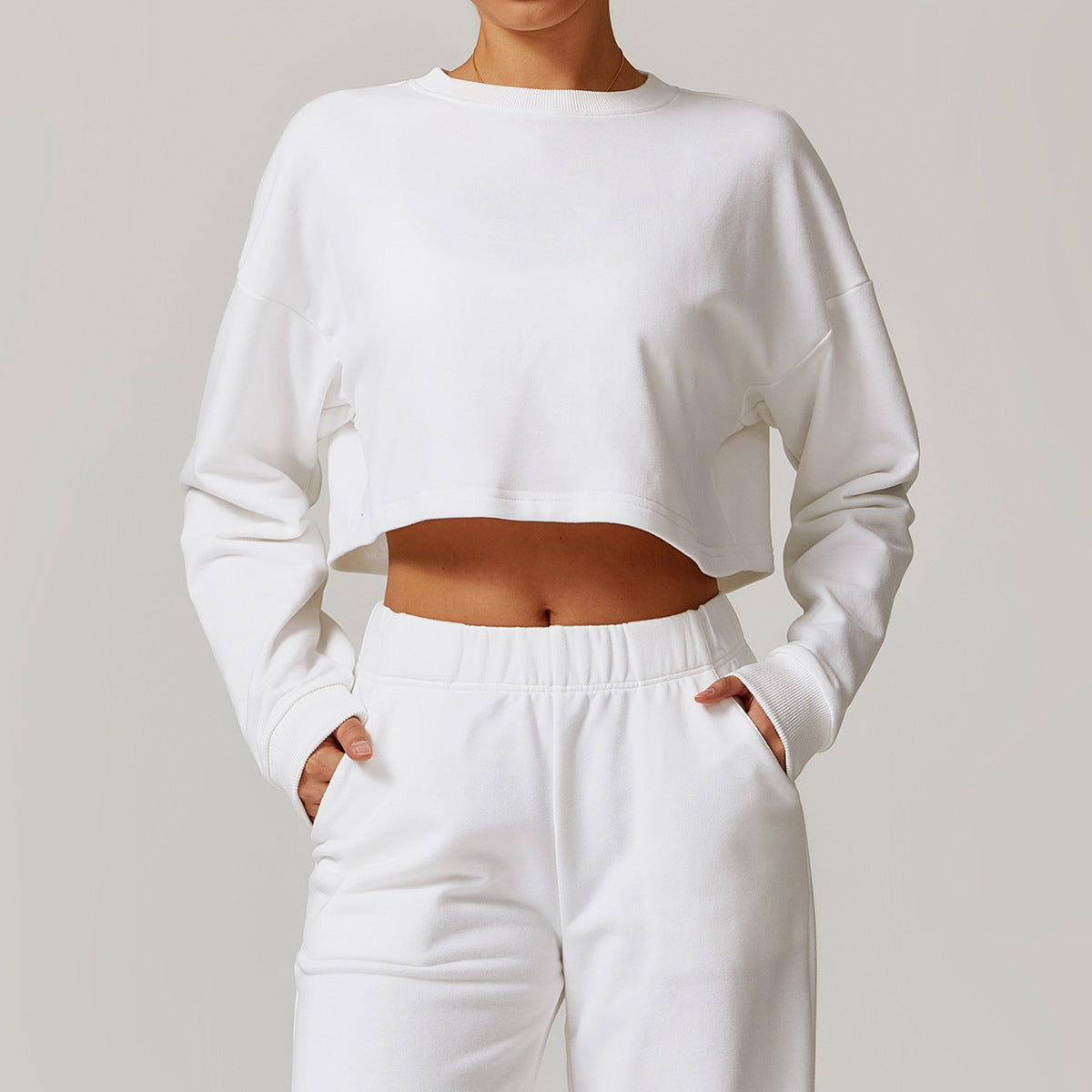 Sudadera deportiva informal holgada de cuello redondo y manga larga con abertura en la espalda para mujer