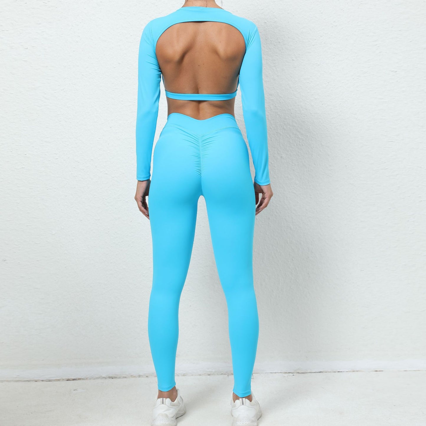 Traje deportivo ajustado de yoga de manga larga sin espalda de color sólido informal a la moda para mujer