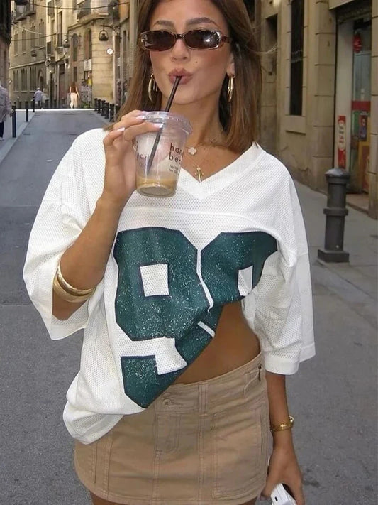 Camiseta de jersey de manga corta holgada con estampado digital de cuadrícula para mujer