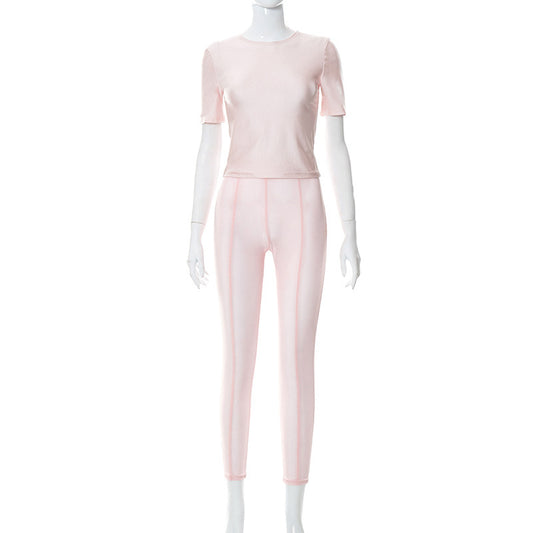 Conjunto de dos piezas para mujer: camiseta de cuello redondo de color liso y pantalón de malla informal que realza la cadera