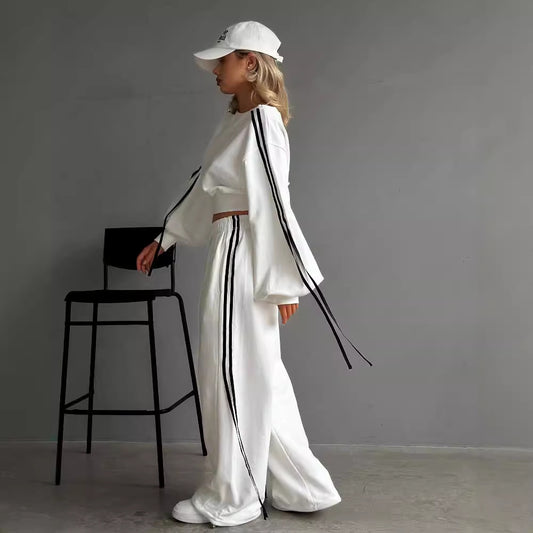 Conjunto de dos piezas de camiseta informal de rayas con hombros descubiertos, manga larga y pantalones con cordones y cintura alta para mujer