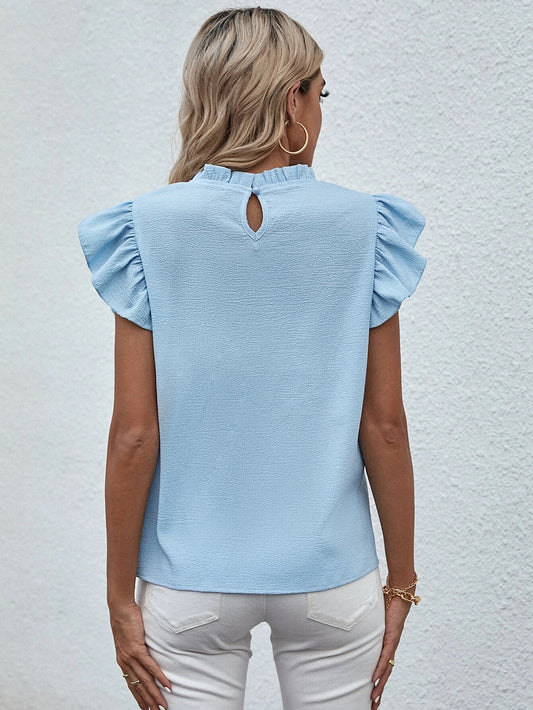 Blusa informal sin mangas con cuello redondo y volantes de color liso a la moda para mujer