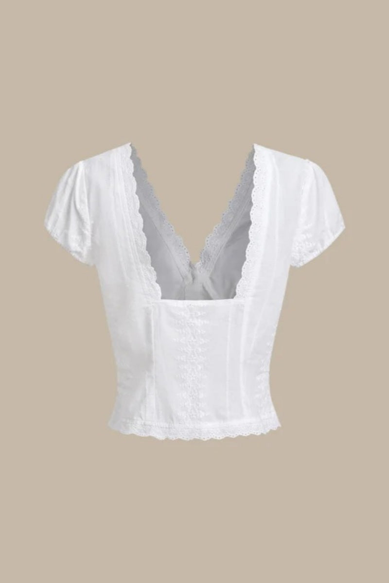 Top blanco texturizado con mangas cortas