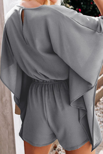 Mono holgado informal de moda con cuello en V y frenillo liso