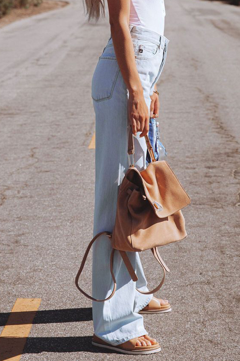 Pantalones de color liso con cintura media, pierna ancha y rotos de estilo urbano