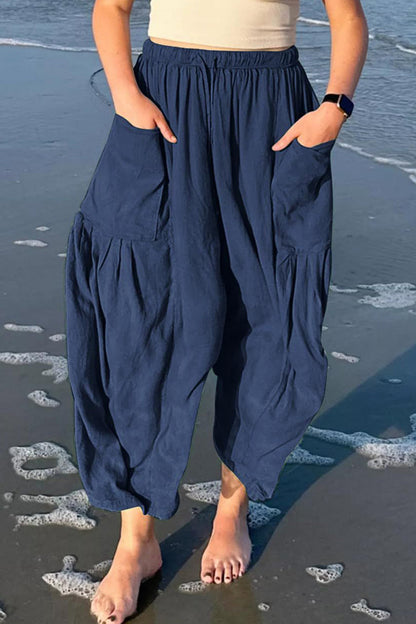 Pantalones casuales sencillos de color liso con bolsillos, holgados, de cintura media y pierna ancha.