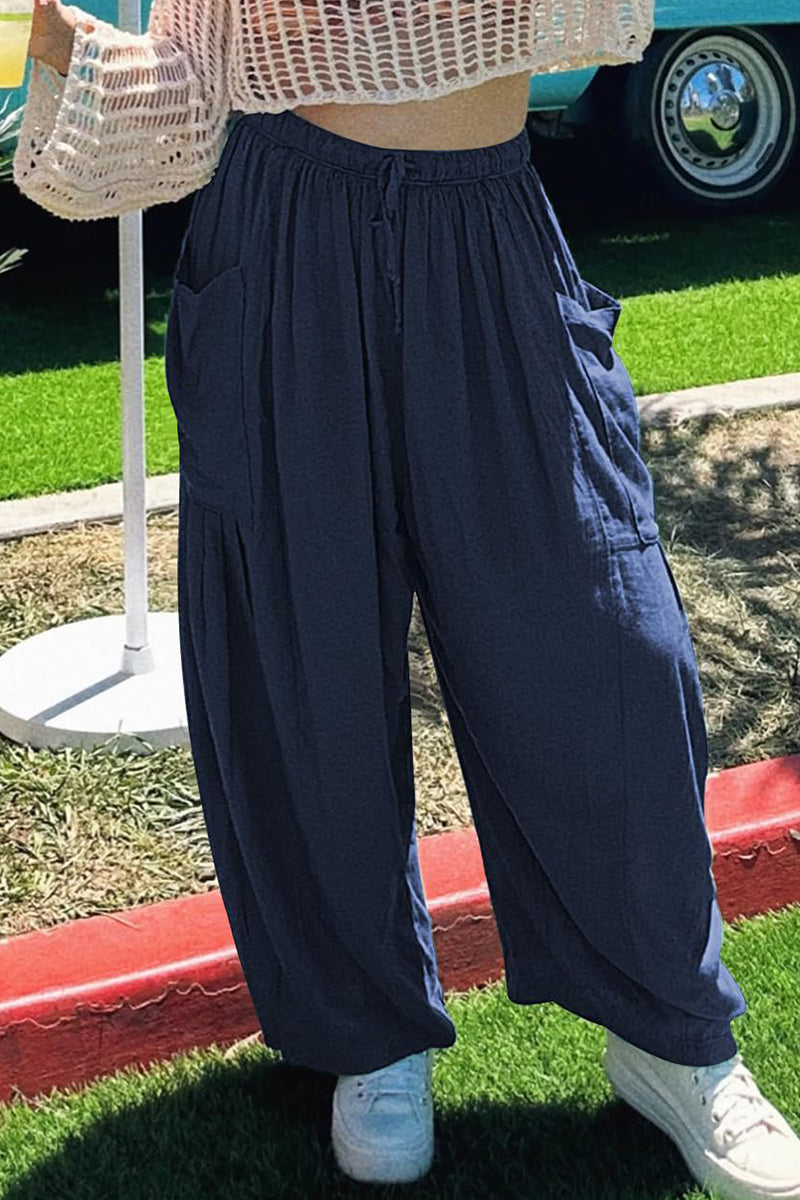 Pantalones casuales sencillos de color liso con bolsillos, holgados, de cintura media y pierna ancha.