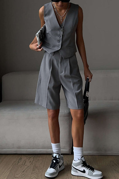 Conjunto de dos piezas elegante estilo británico con cuello en V, sin mangas, bolsillos sólidos y botones