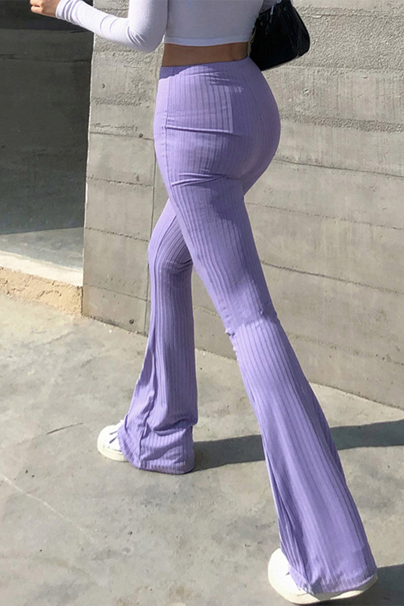 Pantalones casuales sencillos de color liso con cintura alta y botones.