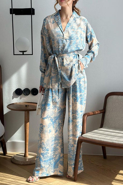 Elegante traje de dos piezas con estampado de grafiti y frenillo de manga larga