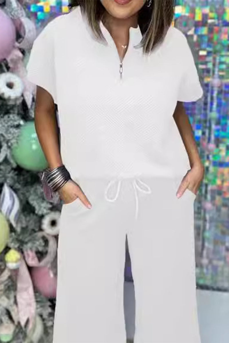 Conjunto informal sencillo de dos piezas con cremallera, cuello vuelto, manga corta y bolsillos sólidos