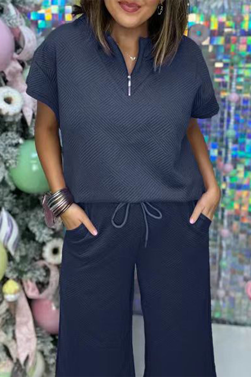 Conjunto informal sencillo de dos piezas con cremallera, cuello vuelto, manga corta y bolsillos sólidos