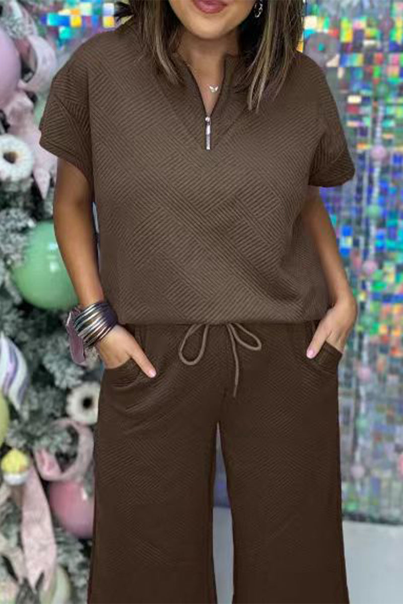 Conjunto informal sencillo de dos piezas con cremallera, cuello vuelto, manga corta y bolsillos sólidos