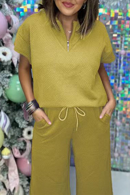 Conjunto informal sencillo de dos piezas con cremallera, cuello vuelto, manga corta y bolsillos sólidos