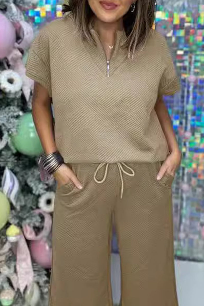 Conjunto informal sencillo de dos piezas con cremallera, cuello vuelto, manga corta y bolsillos sólidos