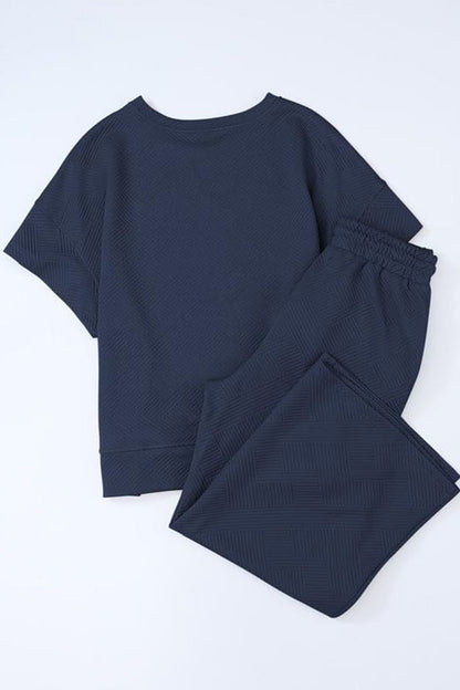 Conjunto informal sencillo de dos piezas con bolsillos lisos, cuello redondo, manga corta (13 colores)