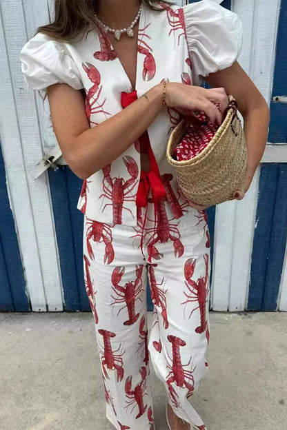 Conjunto de dos piezas con estampado animal, cuello en V, manga corta y lazo