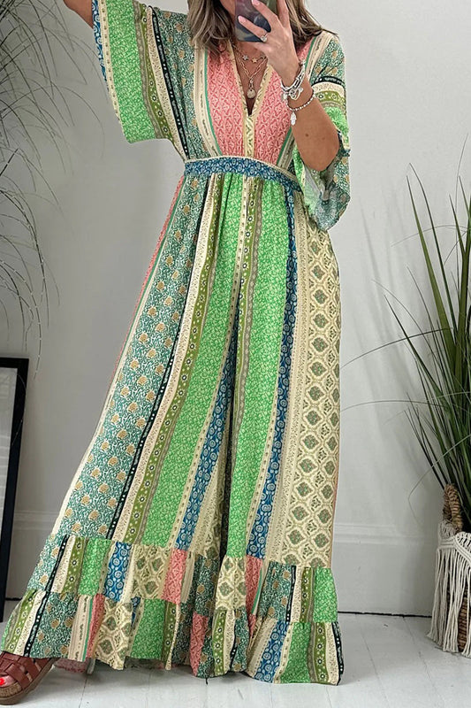 Mono holgado elegante con estampado geométrico, bolsillo, frenillo, espalda descubierta y cuello en V