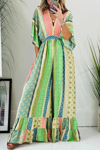 Mono holgado elegante con estampado geométrico, bolsillo, frenillo, espalda descubierta y cuello en V