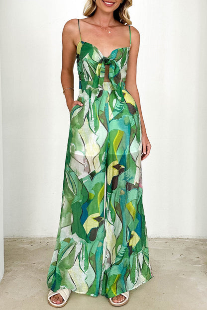 Mono holgado informal con cuello en V en contraste y bolsillos con estampado floral