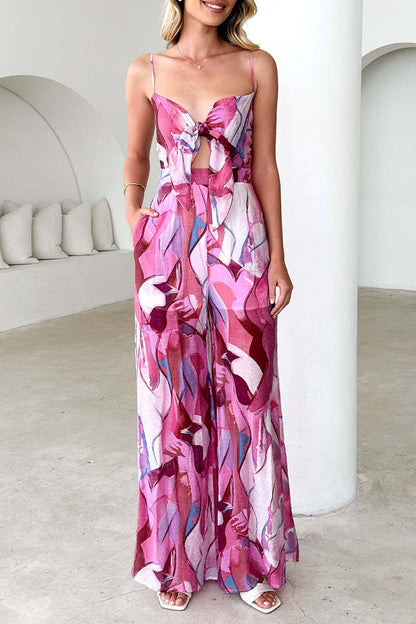 Mono holgado informal con cuello en V en contraste y bolsillos con estampado floral