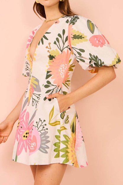 Minivestido con bolsillos, mangas abullonadas y estampado floral