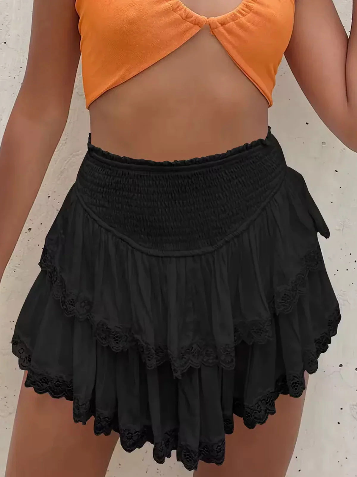 Conjunto de suéter de punto extragrande con mangas murciélago y minifalda con volantes