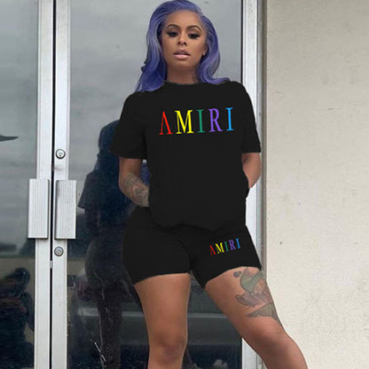 Conjunto de 2 piezas de pantalones cortos ajustados de manga corta con cuello redondo y estampado de letras de color sólido para mujer