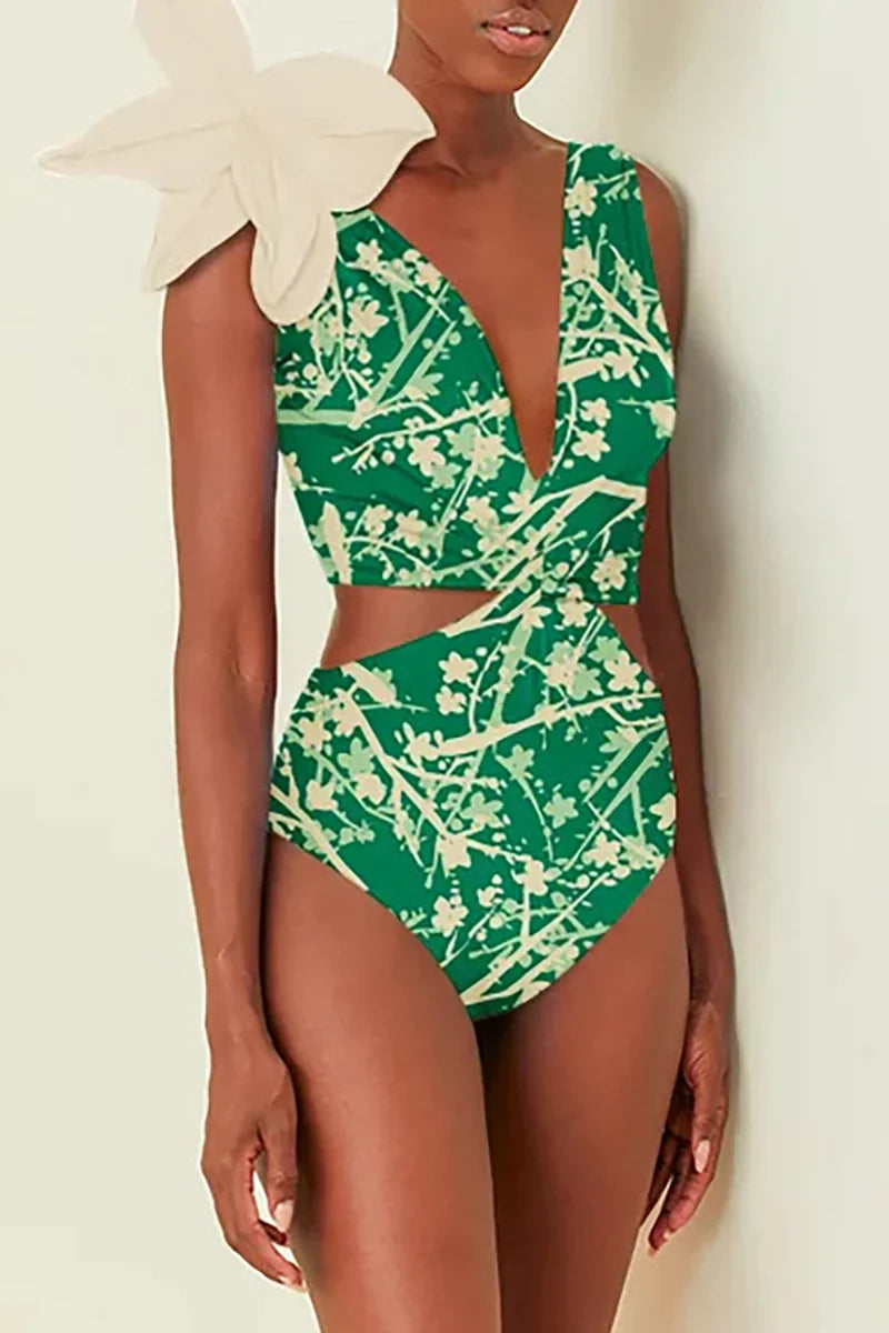 Traje de baño de una pieza con estampado verde y apliques florales