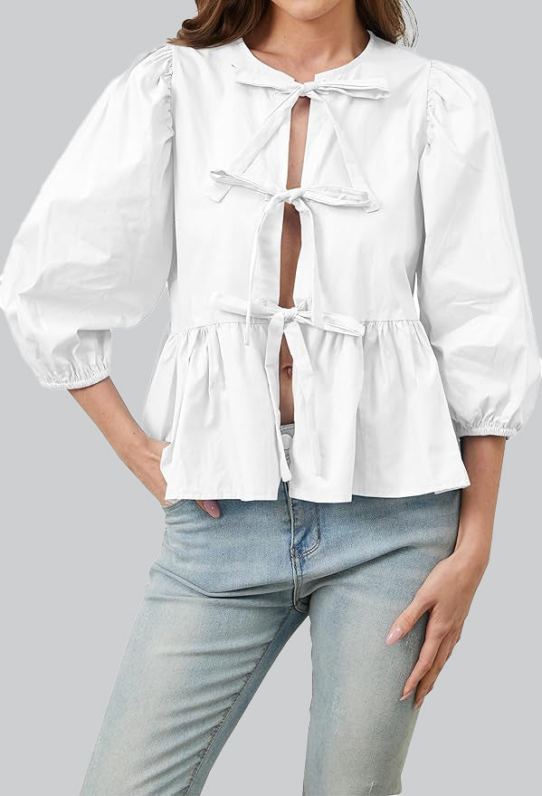 Blusa con mangas abullonadas, peplum y lazos
