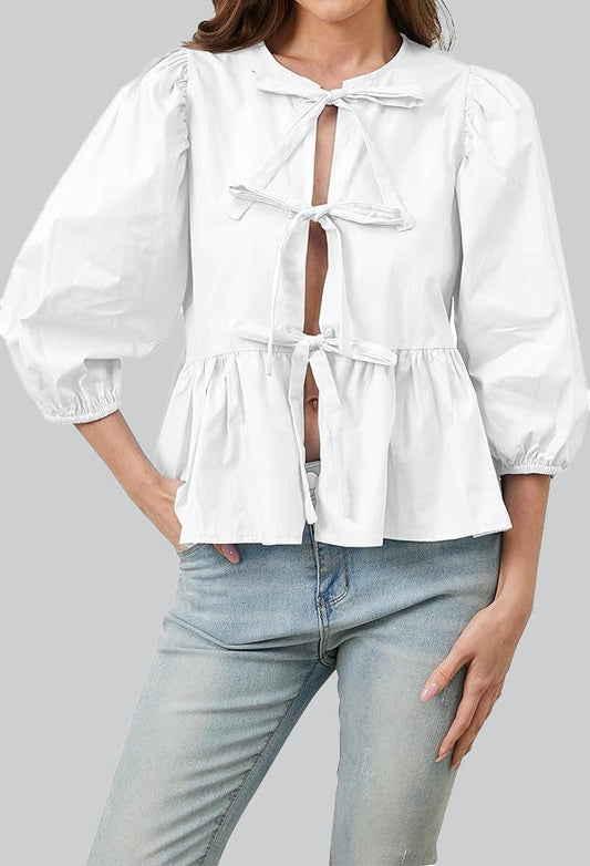 Blusa con mangas abullonadas, peplum y lazos