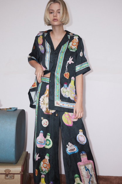 Conjunto de pantalones con estampado de floreros y cuello en V Philomène