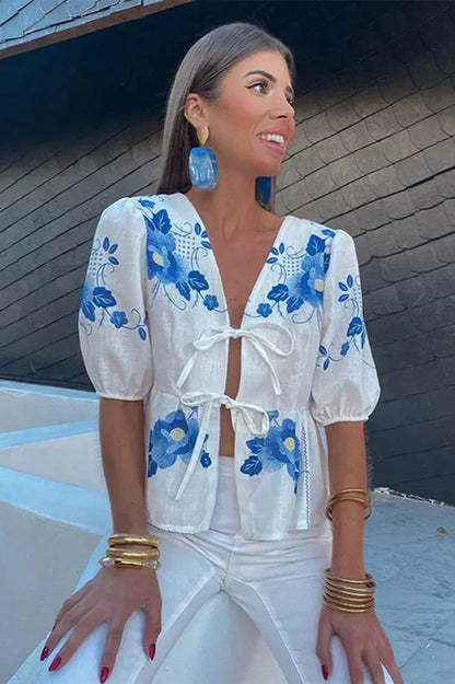 Blusa peplum con lazo floral