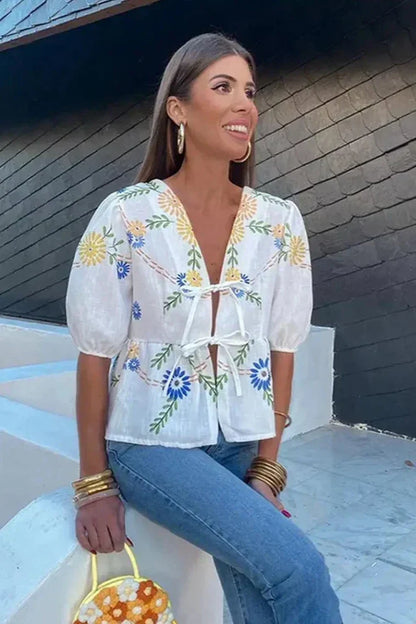 Blusa peplum con lazo floral