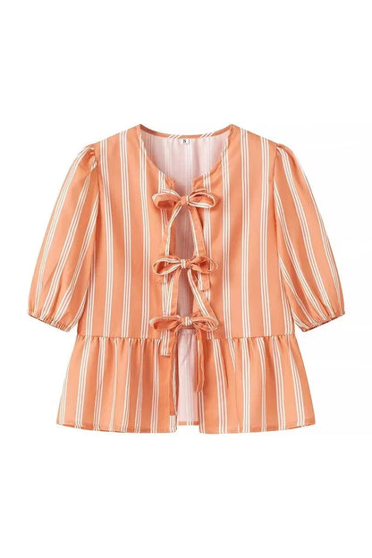 Blusa de rayas con mangas abullonadas y lazos peplum