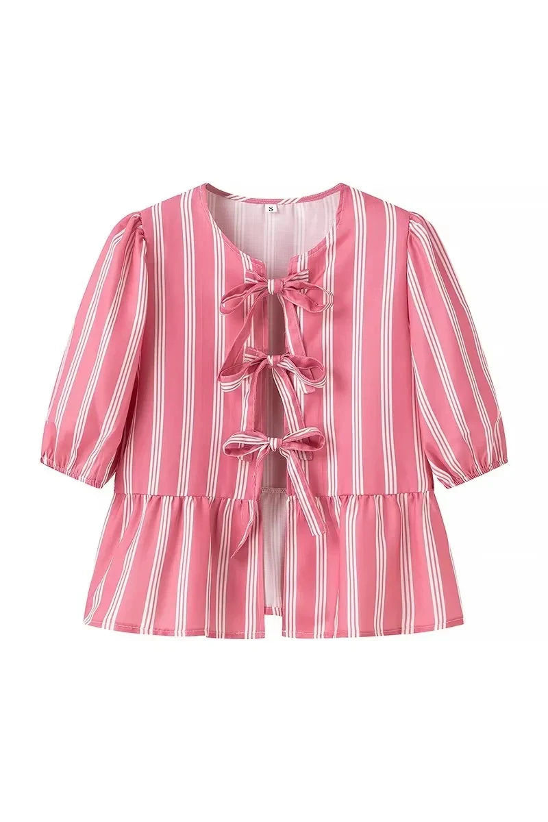 Blusa de rayas con mangas abullonadas y lazos peplum