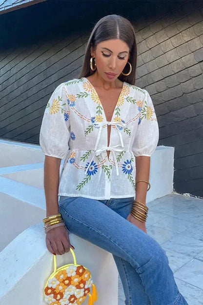 Blusa peplum con lazo floral