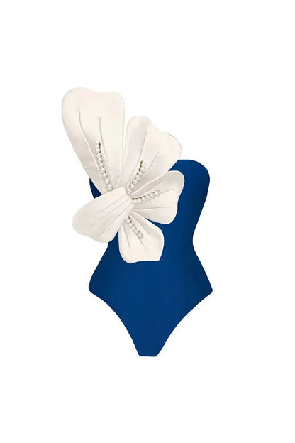 Conjunto de traje de baño azul con detalles florales de perla
