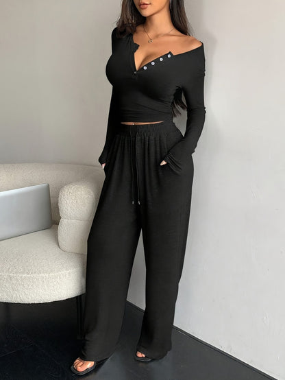 Conjunto de dos piezas de camiseta y pantalones holgados de manga larga ajustados de color liso para mujer