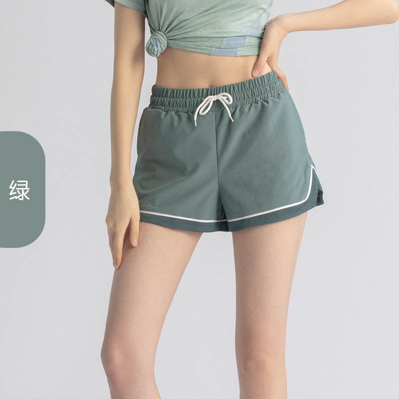Pantalones cortos deportivos informales para correr, elásticos, antidecoloración, de dos piezas, sueltos y falsos para mujer