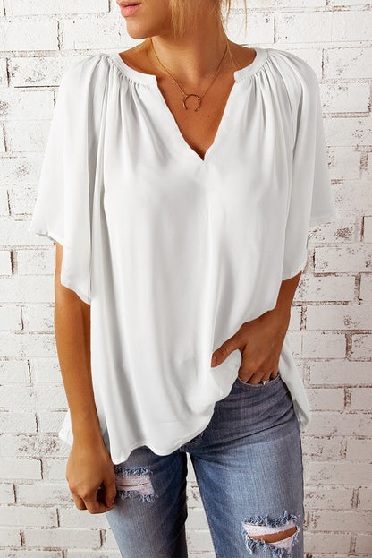Blusa informal holgada de color liso con cuello en V y manga corta para mujer