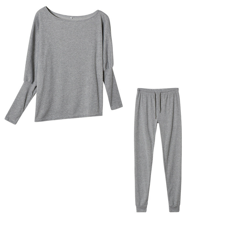 Conjunto de dos piezas formado por top y pantalón ajustado, manga larga, hombros descubiertos, color liso, informal, a la moda para mujer