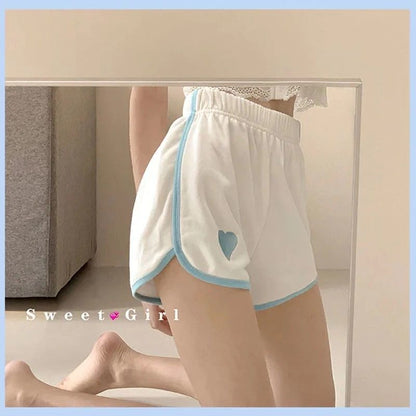 Pantalones cortos deportivos de moda para mujer, estilo deportivo, con estampado de corazones y bloques de color, para correr y yoga.