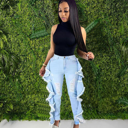 Vaqueros ajustados con borlas y volantes rotos para mujer
