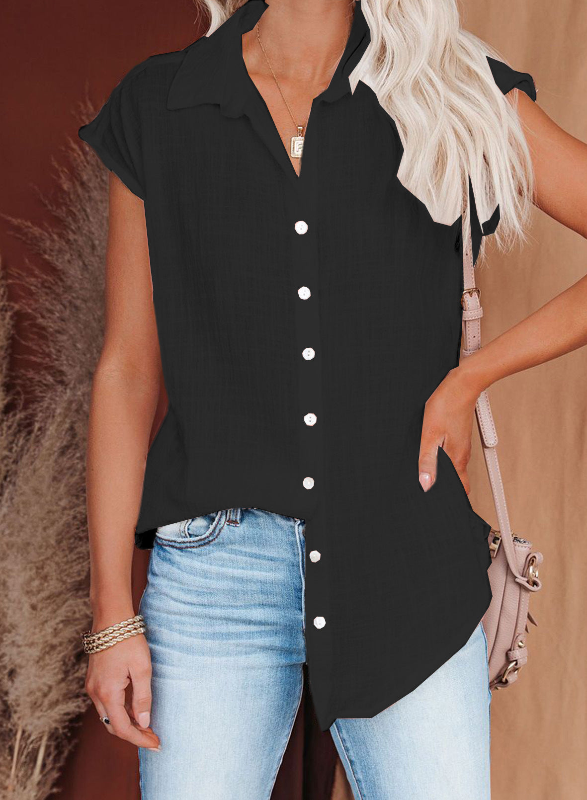 Blusa informal holgada de color liso con solapa y botonadura sencilla sin mangas para mujer