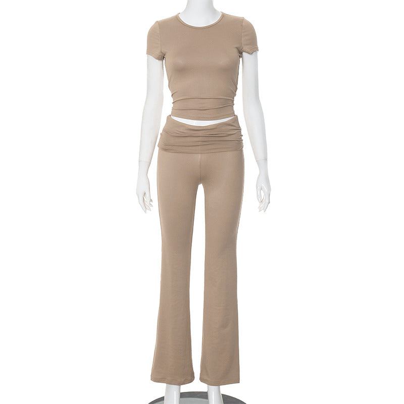 Conjunto de dos piezas formado por top corto y pantalón de manga larga, cuello redondo, color liso, informal, a la moda para mujer