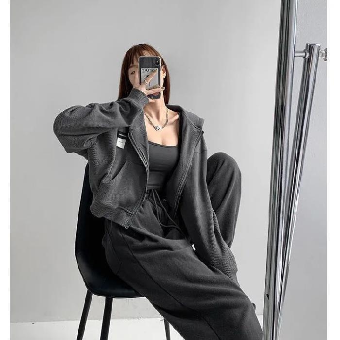 Conjunto de dos piezas formado por top holgado de manga larga y pantalón informal de cintura alta elástica, color liso, para mujer