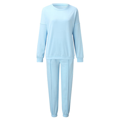 Conjunto de dos piezas holgado e informal con top y pantalón de manga larga y cuello redondo de color liso para mujer
