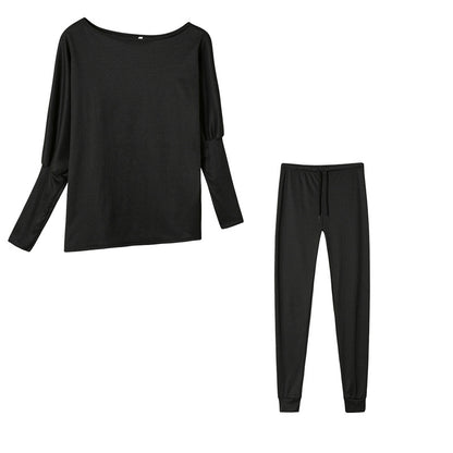 Conjunto de dos piezas formado por top y pantalón ajustado, manga larga, hombros descubiertos, color liso, informal, a la moda para mujer